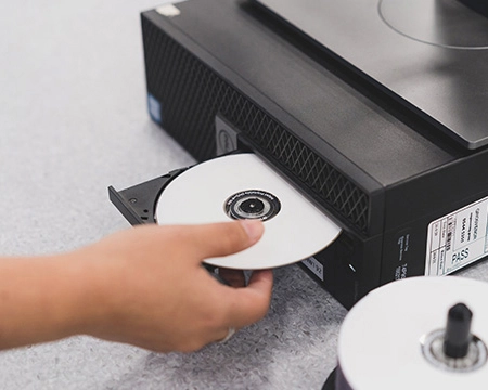 Disc being placed into a computer