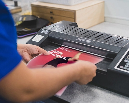  Team member laminating a document