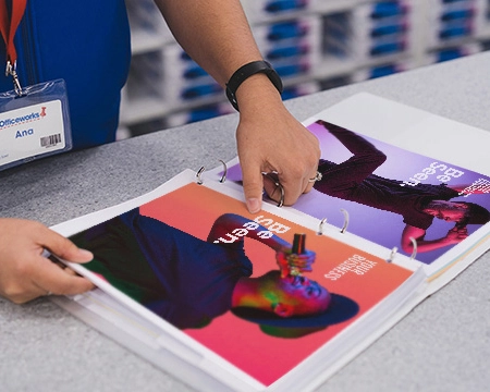  Team member putting documents into a folder