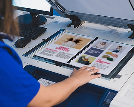 Team member scanning a document at a printer